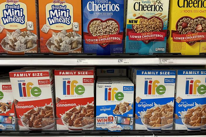 Boxes of cereal are displayed on a shelf at a Target store in July 2022 in San Rafael, Calif. Manufacturers are using "shrinkflation" techniques as costs to produce goods increase. Some are making the packaging smaller but charging the same prices as they were prior to the reduction in size.