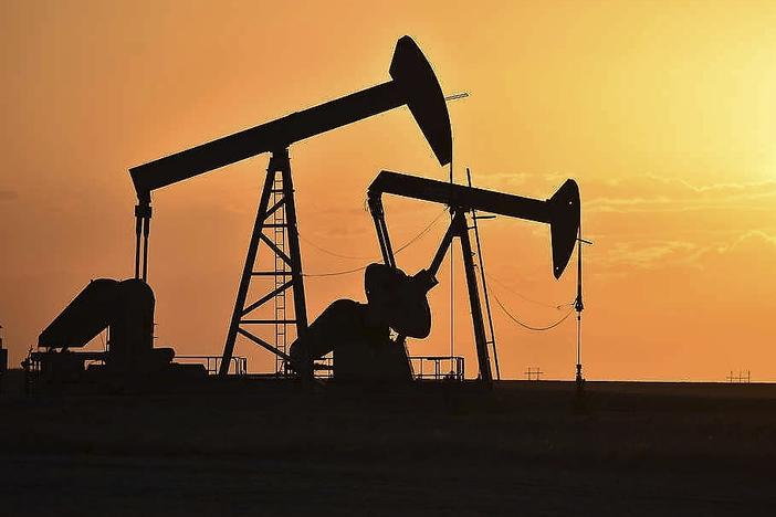 Pump jacks extract oil from beneath the ground in North Dakota on May 19, 2021. The federal government announced a $241.5 million settlement with Marathon Oil on Thursday for alleged air quality violations at the company's oil and gas operations in the Forth Berthold Indian Reservation in North Dakota. 