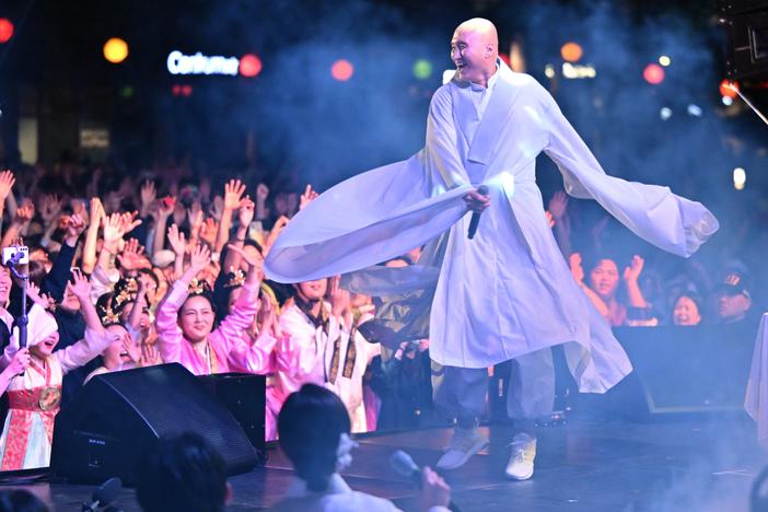 South Korean comedian Yoon Seong-ho, known as NewJeansNim, wearing monk's robes and performing during an electronic dance music party event for the annual Lotus Lantern Festival to celebrate the Buddha's birthday in Seoul, on May 12.