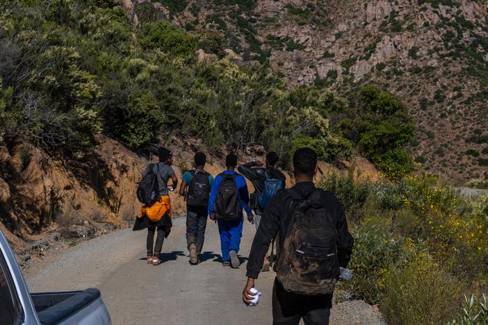 Volunteers with Border Relief Collective provide aid to migrants in the Otay Mountain Wilderness near San Diego, California. Dozens of migrants seeking asylum come through the intensely rugged area each day.