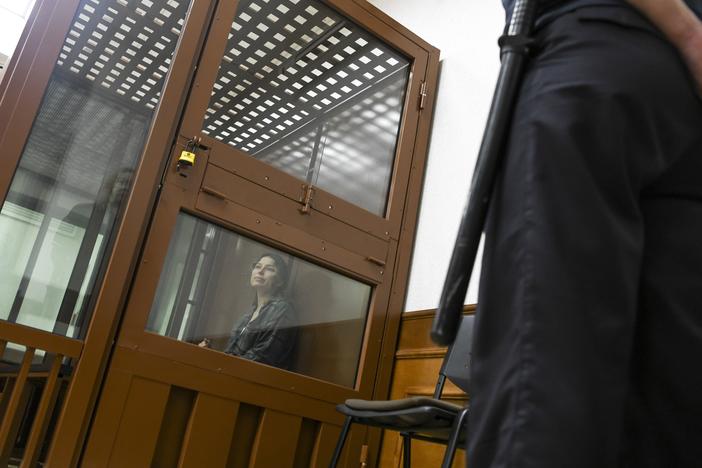 Ksenia Karelina, also known by the last name of Khavana, sits in a defendant’s cage in a court in Yekaterinburg, Russia, on June 20, 2024. The dual Russian-U.S. citizen was arrested on treason charges in Yekaterinburg in February after returning from Los Angeles to visit relatives. The charges reportedly stem from her $51 donation to a U.S. charity that helps Ukraine.