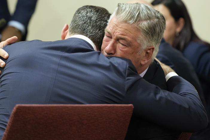 Actor Alec Baldwin hugs his attorney Alex Spiro.