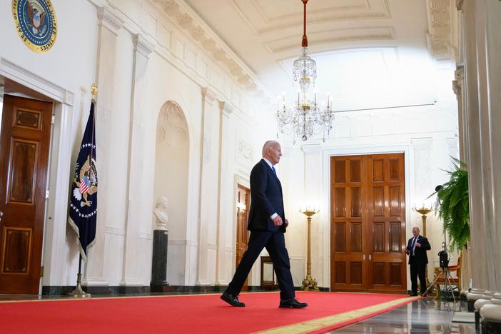 President Biden walks through the Cross Hall of the White House on July 1.