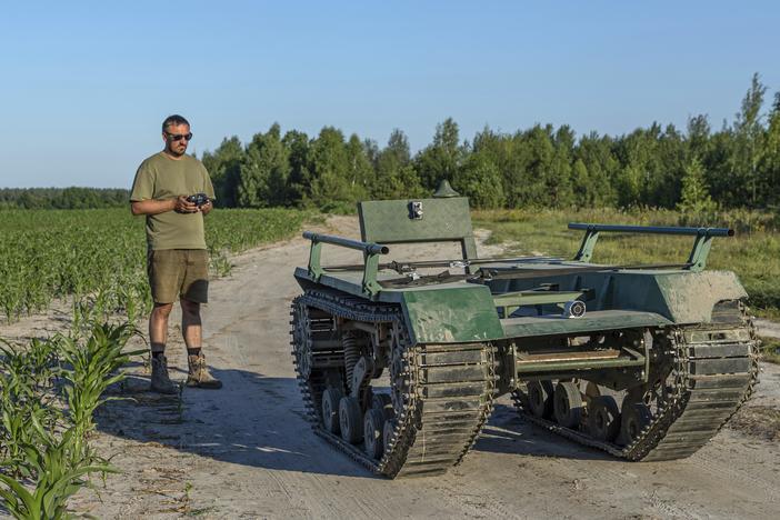 Andrii Denysenko, CEO of design and production bureau "UkrPrototyp," stands by Odyssey, an 800-kilogram (1,750-pound) ground drone prototype, at a cornfield in northern Ukraine on June 28, 2024. Facing manpower shortages and uneven international assistance, Ukraine is counting heavily on innovation at home to halt Russia’s incremental but pounding advance in the east.