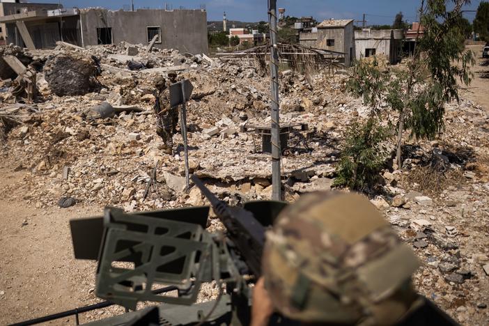 Members of the Lebanese army and the Italian contingent of the UNIFIL peacekeeping force inspect a house destroyed by an Israeli attack during a patrol in Yarine on June 10, 2024.