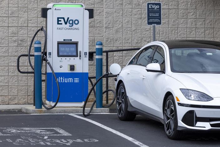 An electric vehicle is seen charging in New Jersey on June 11, 2024. 