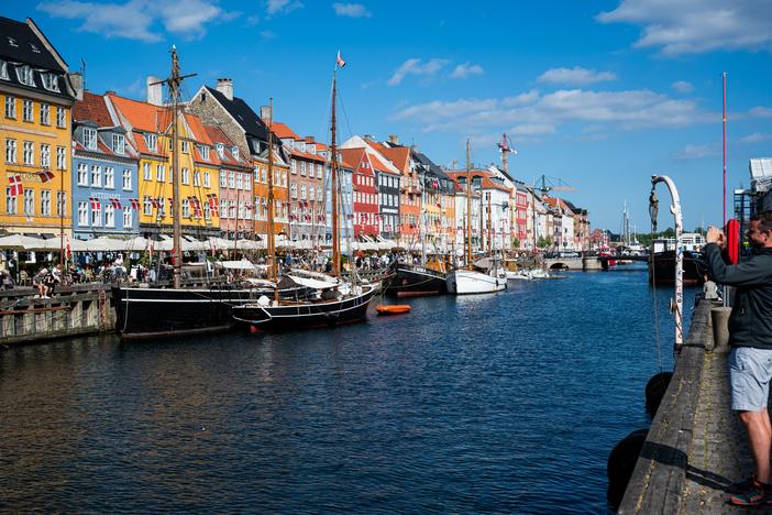 Tourists visit the Nyhavn, a 17th-century waterfront, in Copenhagen, Denmark, in this 2021 file photo.