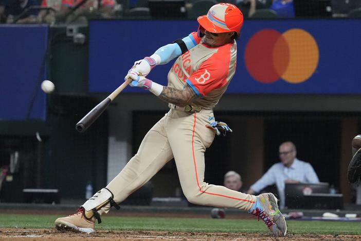 The American League's Jarren Duran of the Boston Red Sox hits a home run during the fifth inning of the MLB All-Star baseball game, Tuesday in Arlington, Texas.