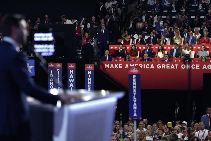 Republican vice presidential candidate Sen. JD Vance, R-Ohio, speaks at the 2024 Republican National Convention on Wednesday in Milwaukee as Republican presidential candidate former President Donald Trump watches. There are more than a dozen so-called "fake electors" from several states serving as delegates at this year's convention. 