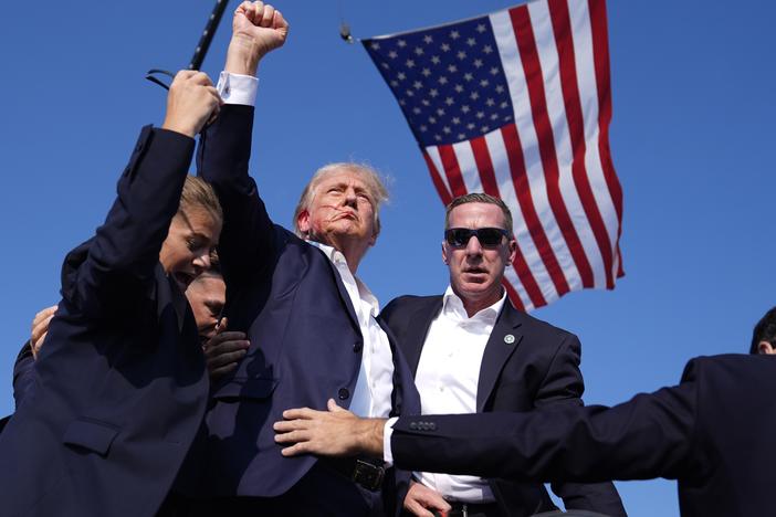 Former President Donald Trump is rushed offstage during a rally in Butler, Pa., after an assassination attempt on his life.