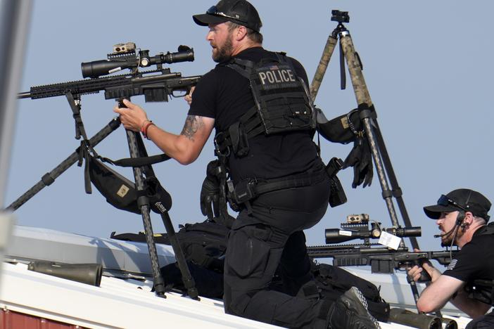 Police snipers return fire after shots were fired while former President Donald Trump was speaking at the campaign rally on July 13.