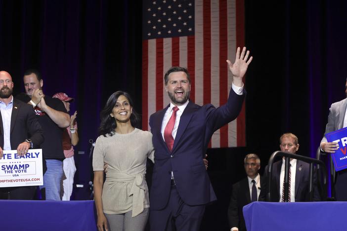 Republican vice presidential candidate Sen. JD Vance, R-Ohio, right, takes the stage with his wife Usha Vance during a rally at Middletown High School in his home town of Middletown, Ohio, Monday.