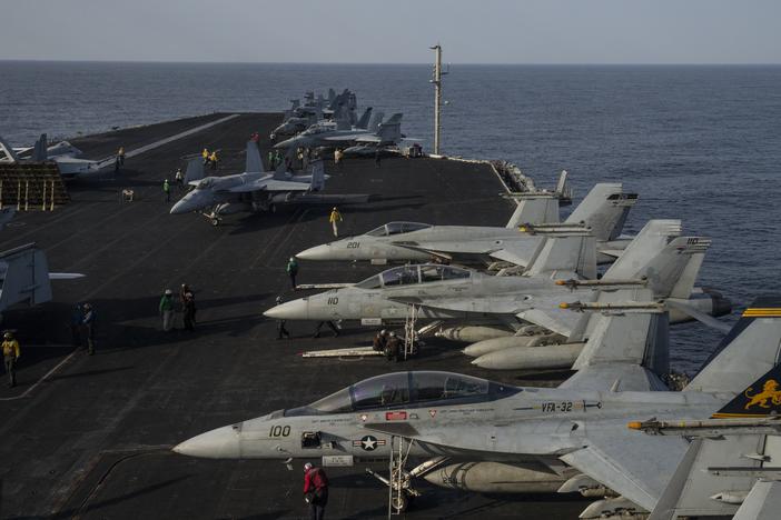 Fighter jets are parked on the deck of the U.S.S. aircraft carrier Dwight D. Eisenhower, also known as the 'Ike', on the south Red Sea, Monday, Feb. 12, 2024. (AP Photo/Bernat Armangue)