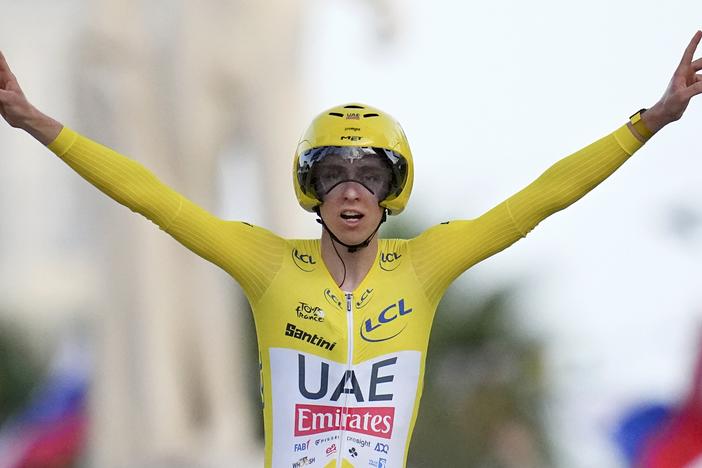 Slovenia's Tadej Pogacar celebrates Sunday as he crosses the finish line to win the twenty-first stage of the Tour de France cycling race, an individual time trial over 33.7 kilometers (20.9 miles) that started in Monaco and finished in Nice, France. 