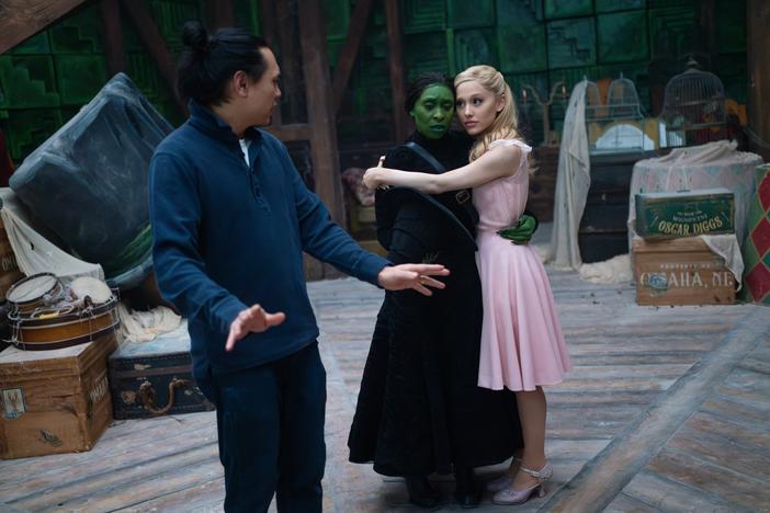  Jon M. Chu directs Cynthia Erivo and Ariana Grande on the set of <em>Wicked</em>.