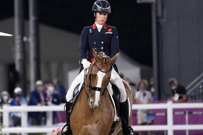 Britain's Charlotte Dujardin competes in the equestrian dressage individual final at the Tokyo Summer Olympics on July 28, 2021. Dujardin has withdrawn from the Paris Games after a video emerged that she says shows her behaving inappropriately while coaching other riders.
