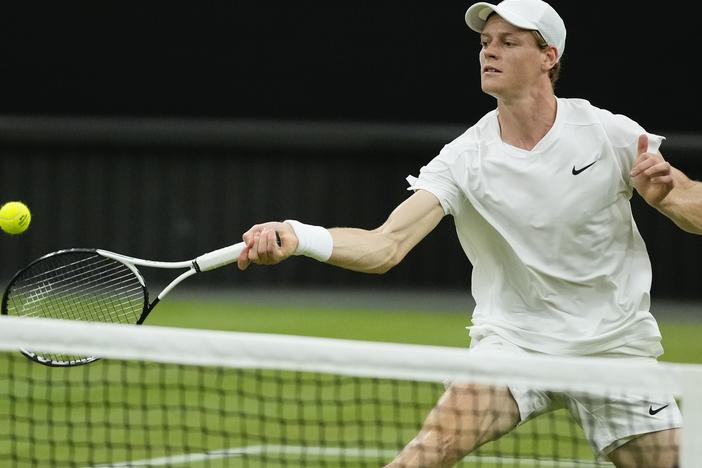Jannik Sinner of Italy plays a forehand return during his third round match at the Wimbledon tennis championships in London, on July 5, 2024. He'll miss the 2024 Paris Olympics due to illness.