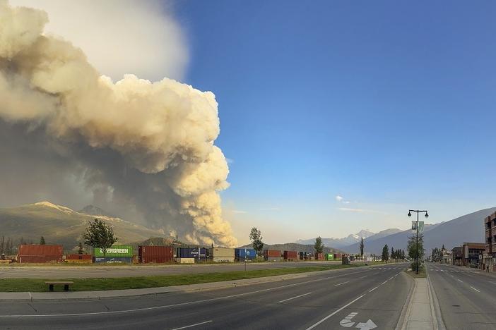 In this photo released by the Jasper National Park, smoke rises from a wildfire burning near Jasper, Alberta, Canada, on Wednesday.
