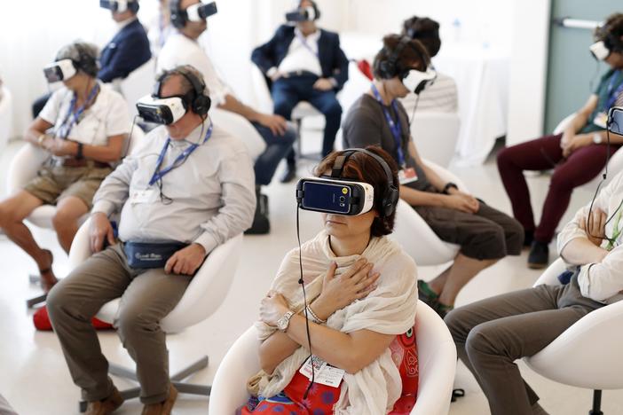 Visitors watch <em>Jesus VR: The Story of Christ</em> during the 73rd Venice Film Festival in 2016.