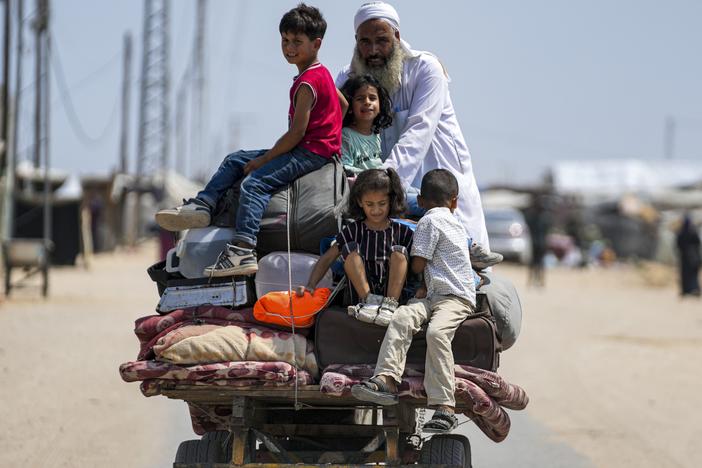 Palestinians displaced by the Israeli air and ground offensive on the Gaza Strip flee from parts of Khan Younis on Saturday, following an evacuation order by the Israeli army to leave parts of the southern area of Gaza Strip's second largest city.