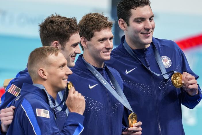 The United States men's 4x100-meter freestyle relay team celebrate after winning the gold medal at the 2024 Summer Olympics on Saturday in Nanterre, France.