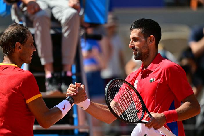 Serbia's Novak Djokovic, right, shakes hands with Spain's Rafael Nadal after the two faced off in the Paris Olympics —  their 60th matchup overall. Nadal has been battling injuries for years, but he rallied for a number of dramatic points in front of an appreciative crowd at Court Philippe-Chatrier at the Roland-Garros Stadium.