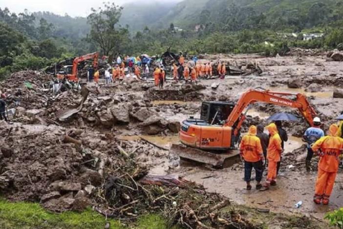 This photograph provided by National Disaster Response Force (NDRF) shows rescuers at a spot after a landslide in Wayanad, southern Kerala state, India, on Tuesday.