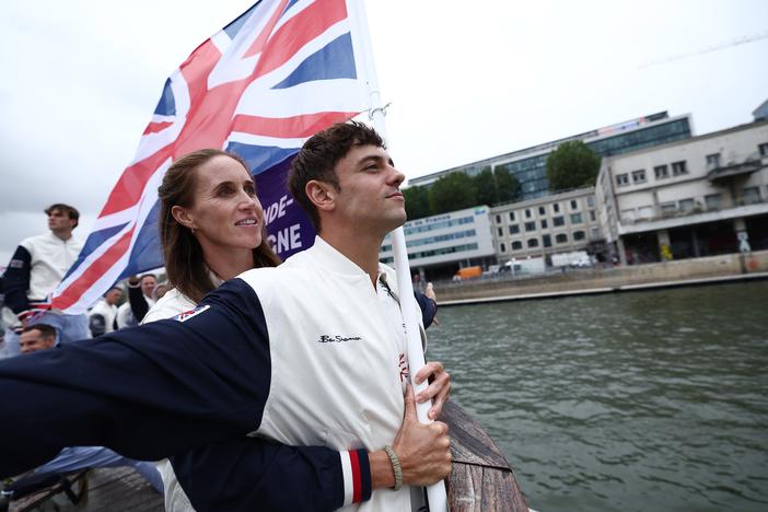 Team Great Britain's Thomas Daley and Helen Glover imitate the iconic "I'm flying!" scene from the film Titanic during the opening ceremony of the Paris Olympics on Friday.