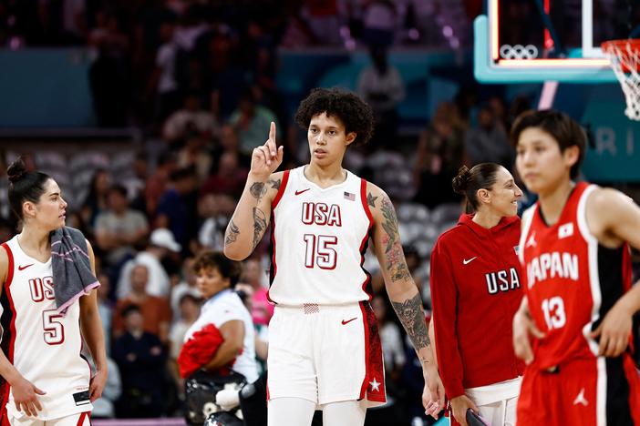 Team USA's Brittney Griner (15) played her first international basketball game since her detention in Russia. She helped the USA women power by Japan in the opening game of group play on Monday as the U.S. aims for an unprecedented eighth straight gold medal.
