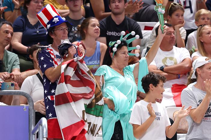 The Paris Olympics are bringing a ratings boost to NBC, the network says. Here, Team USA fans show their support during a men's preliminary volleyball match in Paris.