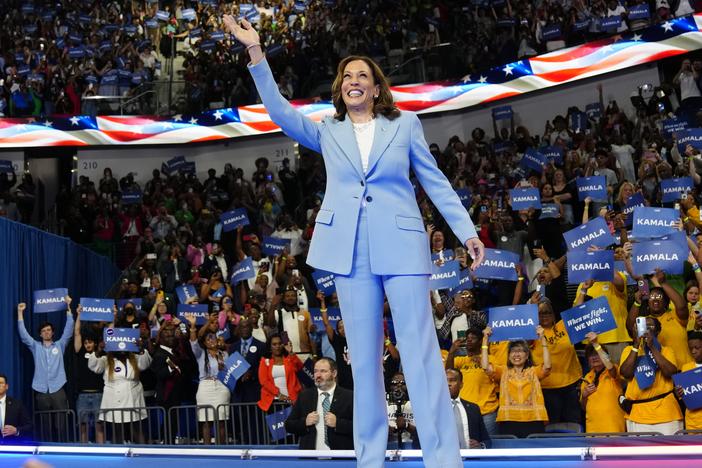 Vice President Harris waves during a packed campaign rally Tuesday in Atlanta.