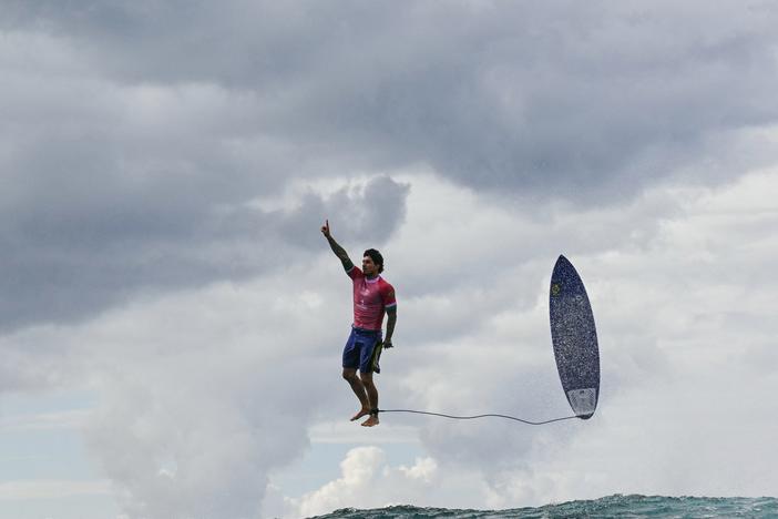 Brazil's Gabriel Medina reacts after getting a large wave in the 5th heat of the men's surfing round 3, during the Paris 2024 Olympic Games, in Teahupo'o, on the French Polynesian Island of Tahiti, on July 29, 2024. 