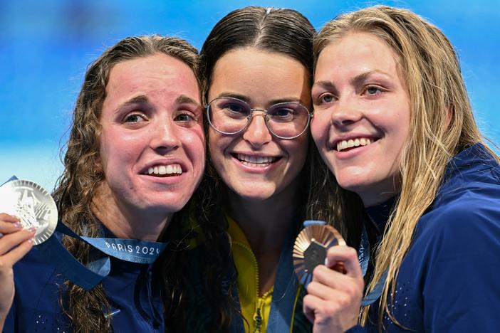 From left, U.S. silver medalist Regan Smith, Australian gold medalist Kaylee McKeown and U.S. bronze medalist Katharine Berkoff pose with their medals following the women's 100-meter backstroke swimming event during the Paris 2024 Olympic Games on Tuesday. Berkoff's bronze was not only the 3,000th medal for Team USA, but also the 600th Olympic medal earned by a USA swimming athlete.