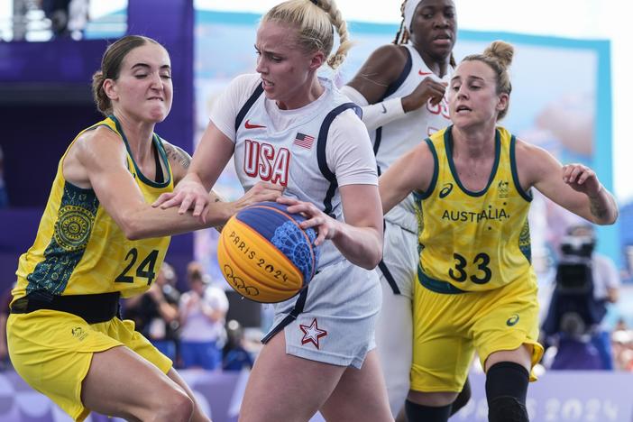 Australia's Anneli Maley (24) and Lauren Mansfield (33) defend Hailey van Lith, of the United States, in the women's 3x3 basketball pool round match Thursday during the 2024 Summer Olympics in Paris. Australia won 17-15.