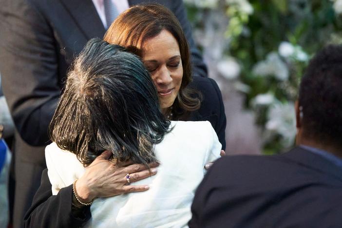 Vice President Harris hugs Robin Harris, the daughter of shooting victim Ruth Whitfield, during Whitfield's funeral service at Mt. Olive Baptist Church in Buffalo, N.Y., on May 28, 2022.