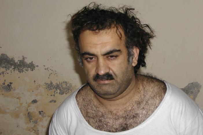 Khalid Sheikh Mohammed, the alleged 9/11 mastermind, is seen shortly after his capture during a raid in Pakistan in March 2003 in this photo obtained by The Associated Press. The man accused of being the main plotter in al-Qaeda's Sept. 11, 2001 attacks has agreed to plead guilty, The Defense Department said Wednesday.