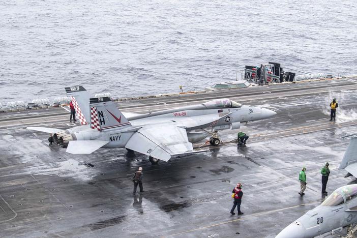 In this photo provided by the U.S. Navy, a U.S. fighter jet prepares to take off from USS Theodore Roosevelt aircraft carrier during the Freedom Edge exercise by the U.S., Japan and South Korea in Sea of Japan on June 28.
