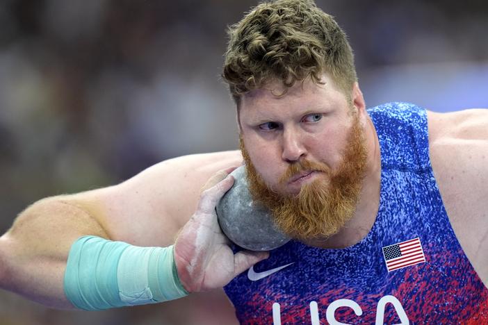Ryan Crouser, of the United States, competes in the men's shot put final at the Paris Olympics. He won his third gold in a row on Saturday.