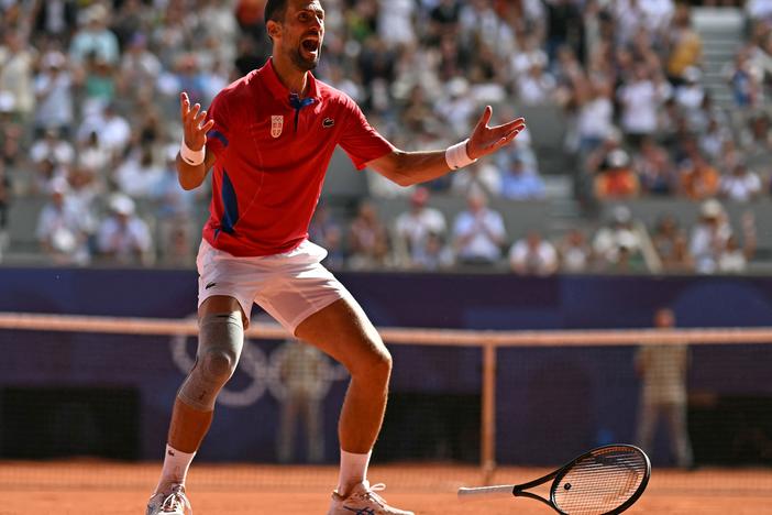 Serbia's Novak Djokovic reacts to beating Spain's Carlos Alcaraz to win gold after their men's singles final tennis match at the Roland-Garros Stadium Sunday during the Paris Olympics. It was Djokovic's first-ever gold medal.