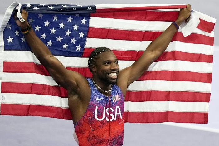 American sprinter Noah Lyles celebrates after winning the gold medal in in the men's 100-meters final at the Paris Olympics on Sunday in Saint-Denis, France.