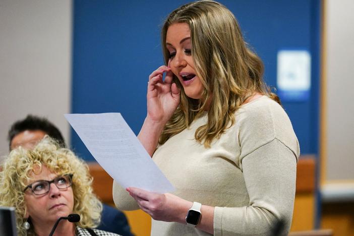 Former Trump attorney Jenna Ellis reads a statement after pleading guilty in Atlanta on Oct. 24, 2023, to one felony count of aiding and abetting false statements and writings in the Fulton County election subversion case.