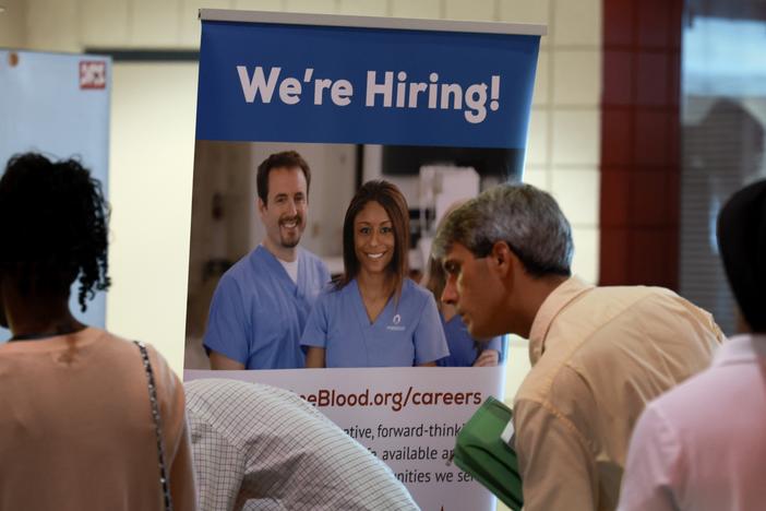 Job seekers attend a job fair in Sunrise, Fl., on June 26, 2024. Employers added only 114,000 jobs last month, well below expectations, raising fears about the economy.