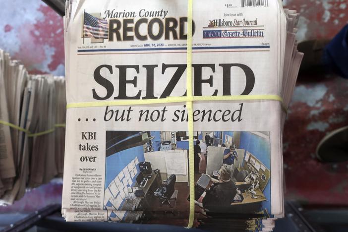 A stack of the Marion County Record sits in the back of the newspaper's building, awaiting unbundling, sorting and distribution, Aug. 16, 2023, in Marion, Kan. Two special prosecutors said on Monday that they plan to file a criminal obstruction of justice charge against a former central Kansas police chief over his conduct following a raid last year on his town's newspaper, and that the newspaper's staff committed no crimes.
