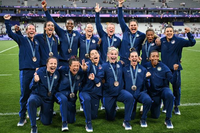 Team USA celebrates with their bronze medals during the victory ceremony during the Paris 2024 Olympic Games at the Stade de France in Saint-Denis on Tuesday. 