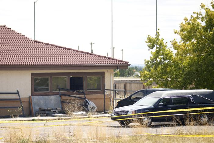 A hearse and van sit outside the Return to Nature Funeral Home in Penrose, Colo., on Oct. 6, 2023. On Monday, a judge ordered the funeral home’s owners, Carie and Jon Hallford, to pay $950 million to families whose loved ones' remains were mishandled.