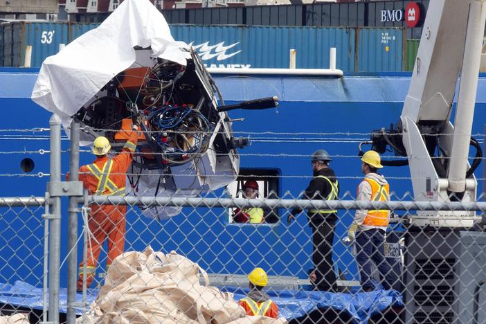 Debris from the Titan submersible, recovered from the ocean floor, is unloaded from the ship Horizon Arctic at the Canadian Coast Guard pier in St. John's, Newfoundland, on June 28, 2023.