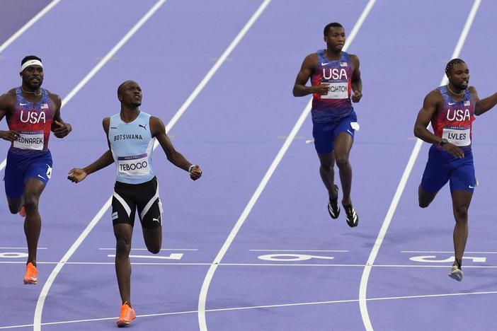 Letsile Tebogo, of Botswana, second left, won the men's 200-meters final at the Paris Olympics in Saint-Denis, France, on Thursday