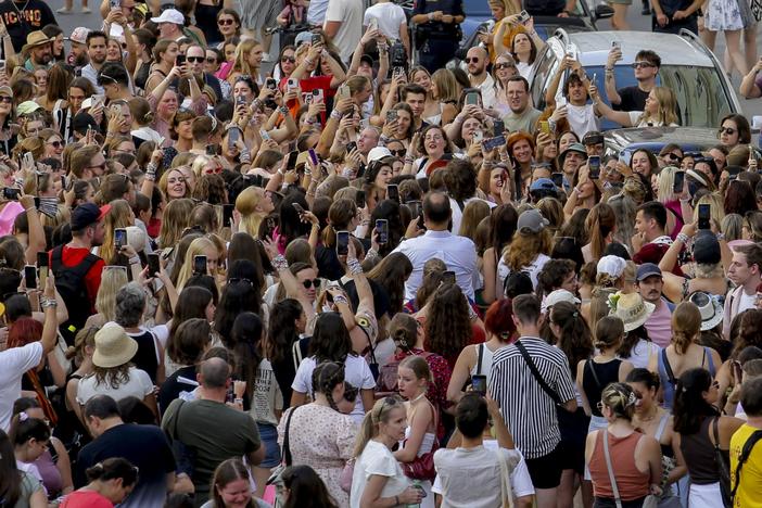 Swifties gather and sing in the city center in Vienna on Thursday. Organizers of three Taylor Swift concerts in the stadium in Vienna this week called them off on Wednesday after officials announced arrests over an apparent plot to launch an attack on an event in the Vienna area such as the concerts.