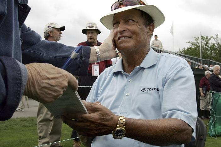 Chi Chi Rodriguez smiles while signing an autograph at the Nashawtuc Country Club in Concord, Mass., on June 9, 2006.