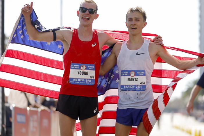 Clayton Young (L) and Conner Mantz celebrate after placing second and first during the 2024 U.S. Olympic Team Trials — Marathon in February.